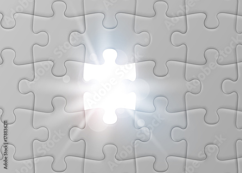White jigsaw puzzle with missed and shining piece. Solution concept.