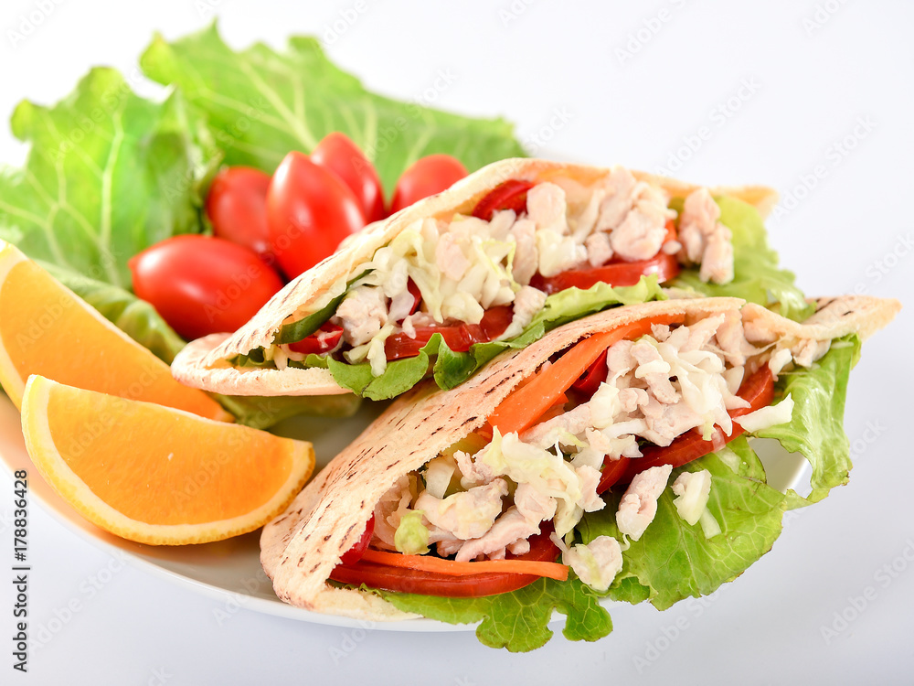 Pita salad breakfast set with chicken,tomato and fresh vegetables.
