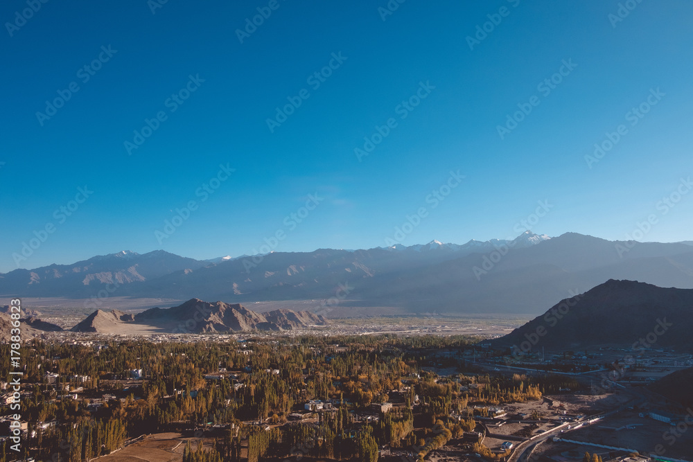 Landscape and building in Leh Ladakh city with mountains and blue sky background