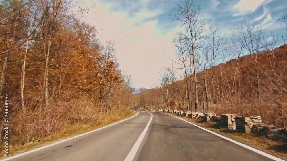 Driving on a road in autumn mountains
Driving on a road in autumn mountains