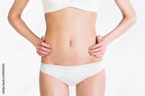 Perfect woman body on white background © Andrei Pozharskiy
