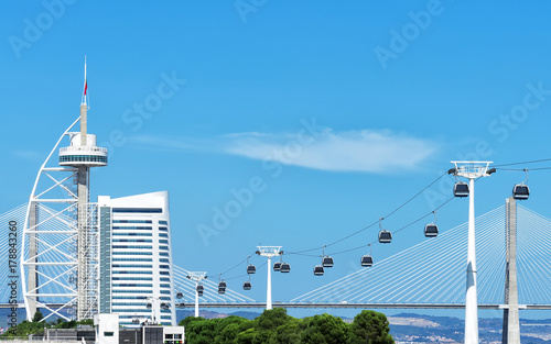 Cable car and Vasco da Gama tower in Lisbon. photo