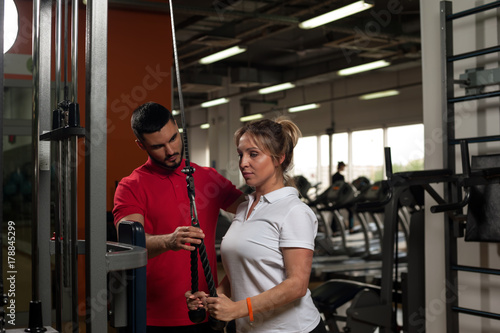 Middle aged woman working out on simulator