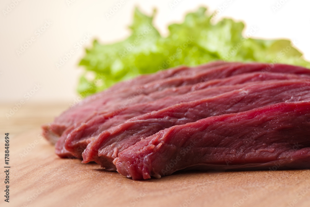 fresh meat on the table cut into pieces, close-up fresh meat on the table cut into pieces, close-up