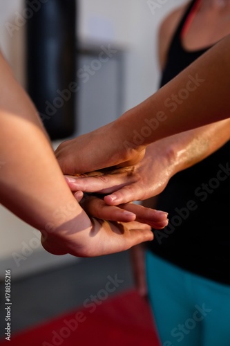 Close-up of stacked athletes hands