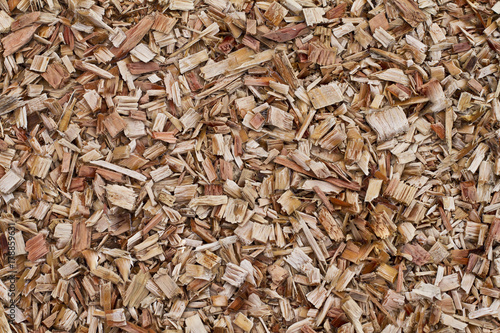 Photos Wood chips background. Fresh wood chips for landscaping