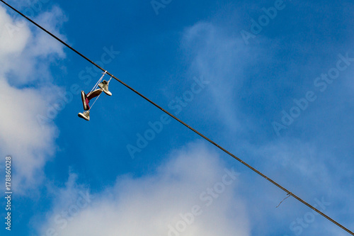 pair of shoes hanging in the sky