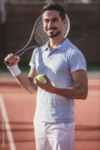 Man playing tennis © georgerudy