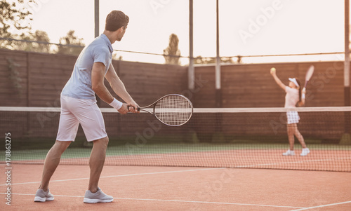 Couple playing tennis © georgerudy