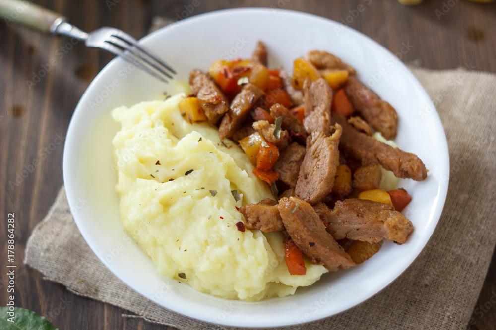 Soy meat with potato puree over kitchen table. Soy meat with potato puree over kitchen table.