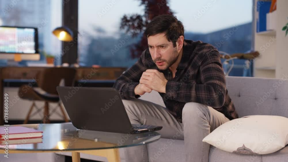 Excited businessman sees something on computer screen which makes him happy. Excited businessman sees something on computer screen which makes him happy.