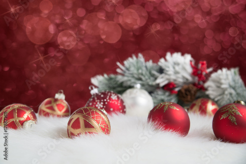 Red ornaments on twinkling background