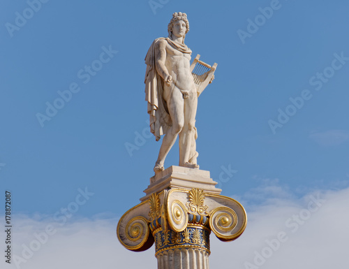 Apollo statue on blue sky background  the ancient greek god of arts  poetry and music