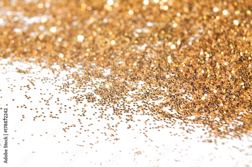 Golden festive glitter background with defocused lights Golden festive glitter background with defocused lights