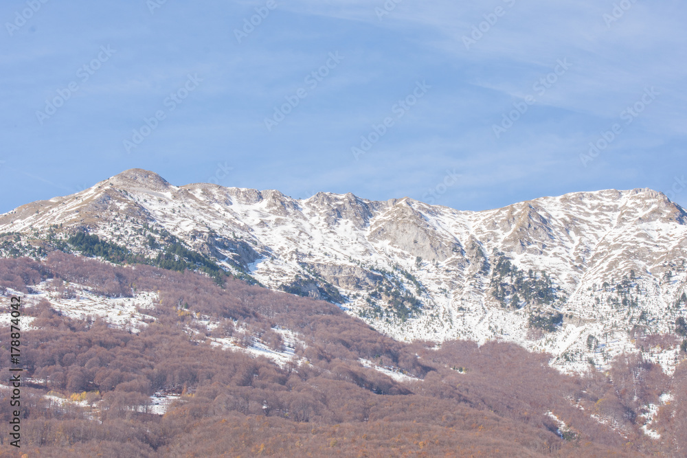 Mountains covered with snow in early Autumn days