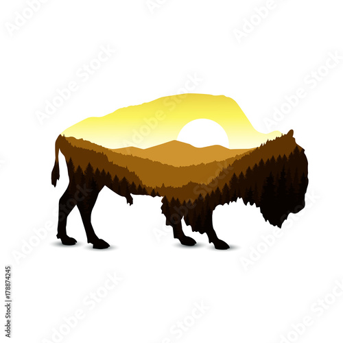 Silhouette of bison with mountain hills.