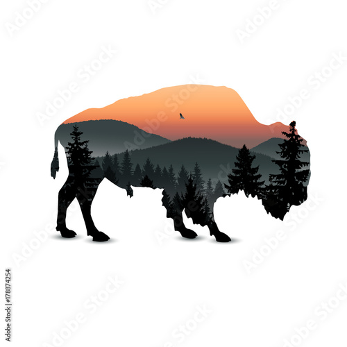 Silhouette of bison with mountain hills.