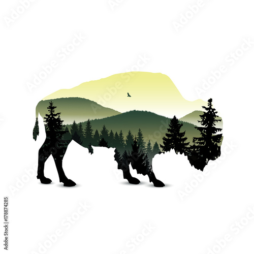 Silhouette of bison with mountain hills.