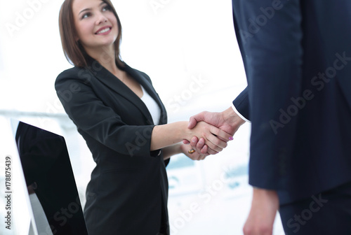business colleagues shaking hands after a successful presentation. © ASDF