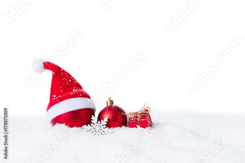 Christmas bauble with Santa Hat on snow isolated on white background
