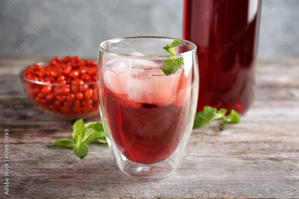 Glass with goji juice on wooden table Glass with goji juice on wooden table