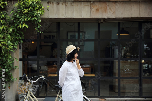 Asian young woman thinking and looking portrait with in coffee shop