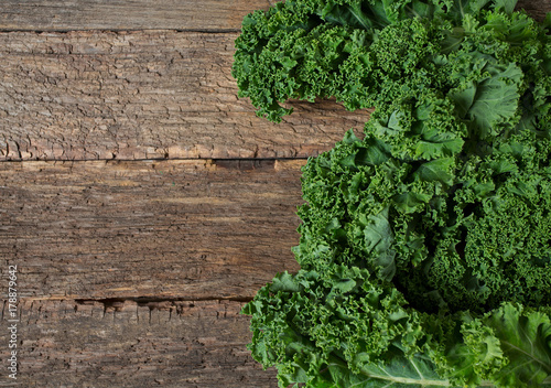 fresh kale on rustic wooden surface