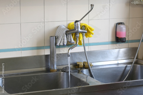 large stainless steel sink in an industrial kitchen