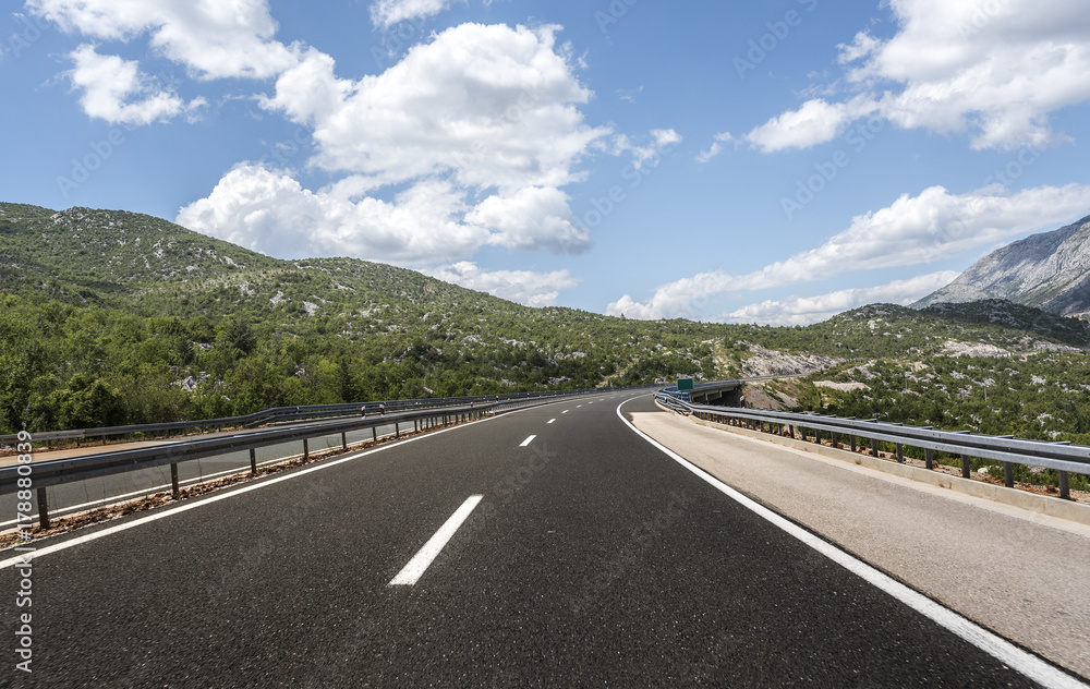 High-speed country road among the mountains. High-speed country road among the mountains.
