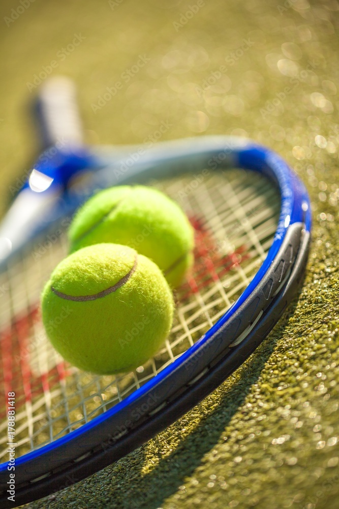 Tennis Racket and Balls on a Tennis Court