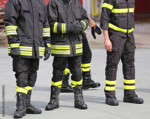 legs with boots of firemen after rescue mission