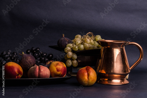 Still life art photography with books fruits on table