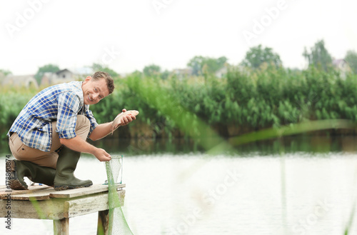 Fisherman holding freshly c...