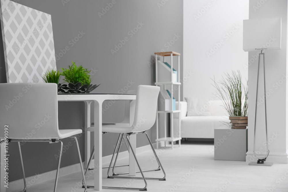 Fototapeta premium Modern room interior with white chairs and table