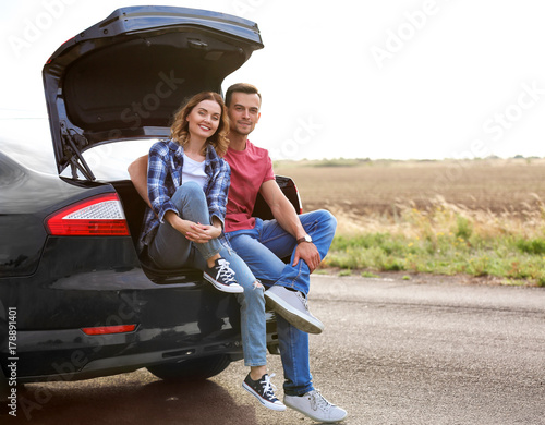 Beautiful young couple near...