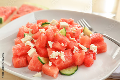 Fresh salad with watermelon on plate, closeup