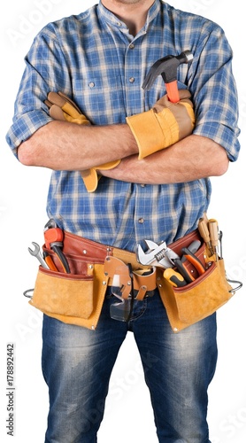 Worker with a tool belt isolated on white background © BillionPhotos.com