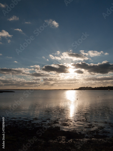 beautiful sunset over harbour coast sea bay clouds silhouette landscape