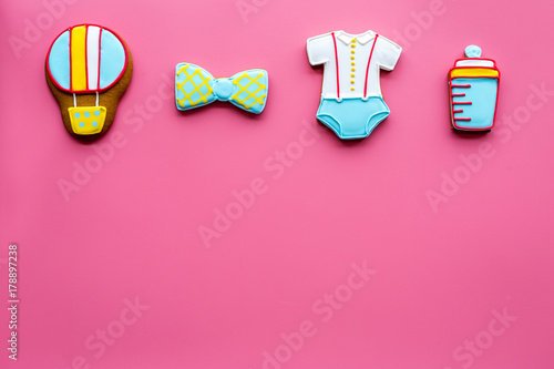 baby shower with cookies for celebration on pink background top view mock up