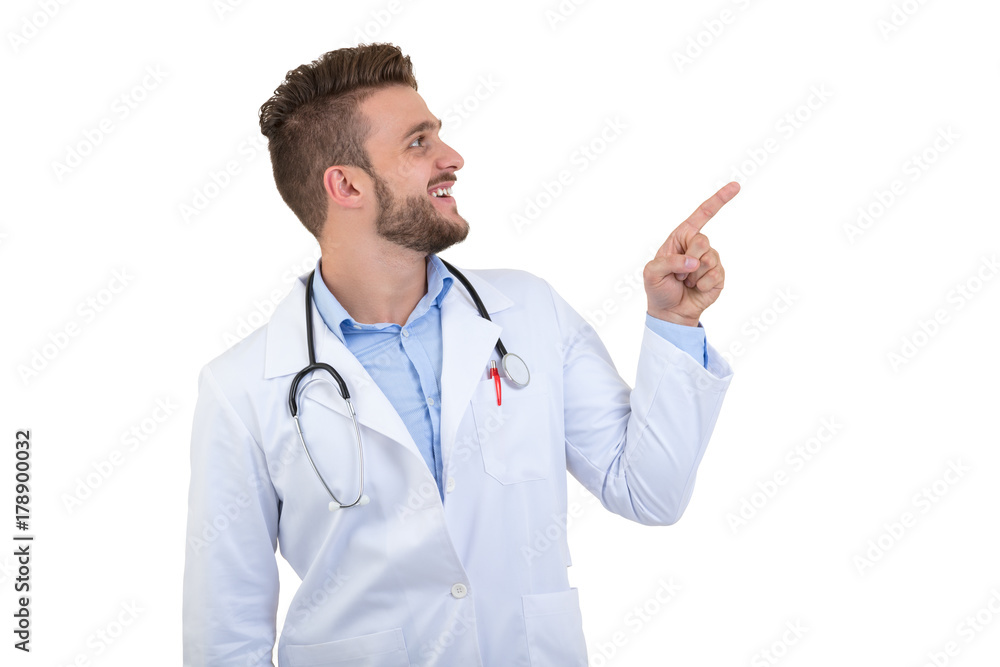 Portrait of a smiling male doctor pointing finger away isolated on a white background Portrait of a smiling male doctor pointing finger away isolated on a white background