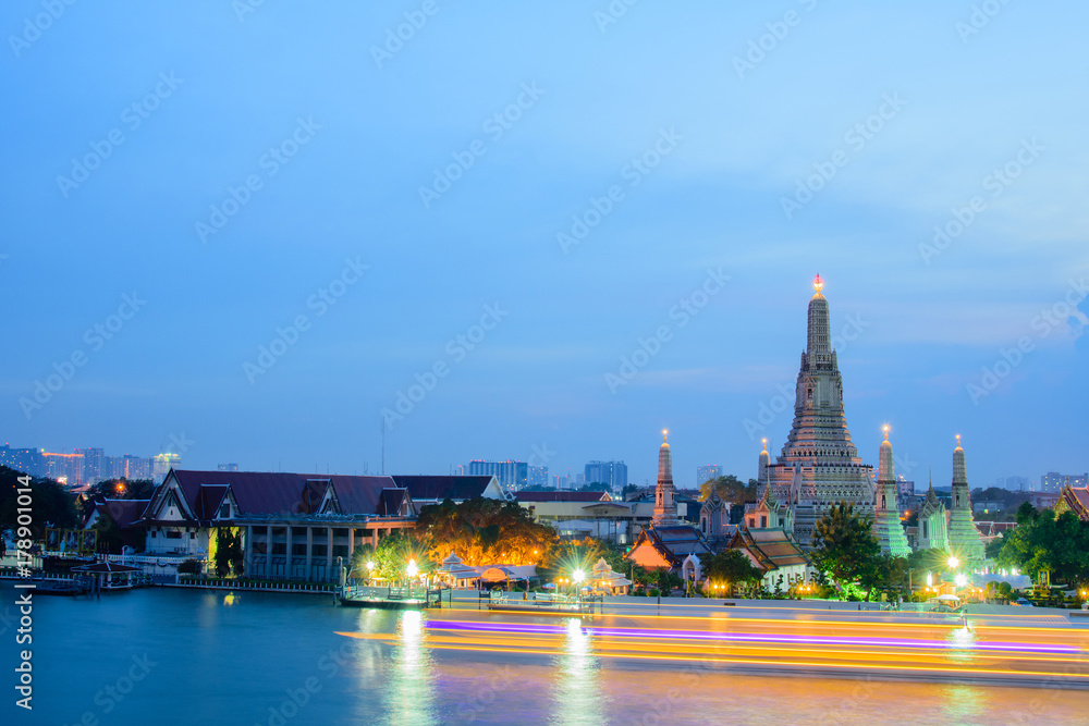 Arun temple famous tourist attraction in twilight time with light trails.Bangkok Thailand.