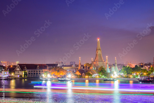 Arun temple famous tourist attraction in night time with light trails.Bangkok Thailand.