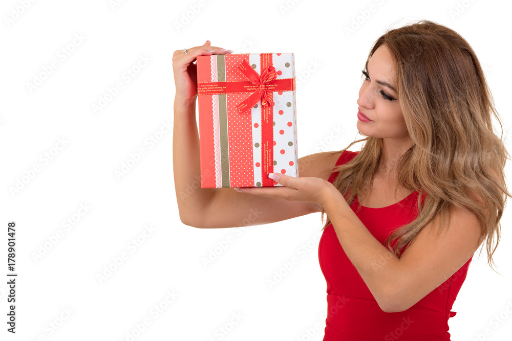 Portrait of casual young happy smiling woman hold red gift box. Isolated studio background female model. Portrait of casual young happy smiling woman hold red gift box. Isolated studio background female model.