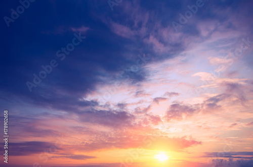 Fototapeta Naklejka Na Ścianę i Meble -  A beautiful sunset with a bright sun and colorful clouds.