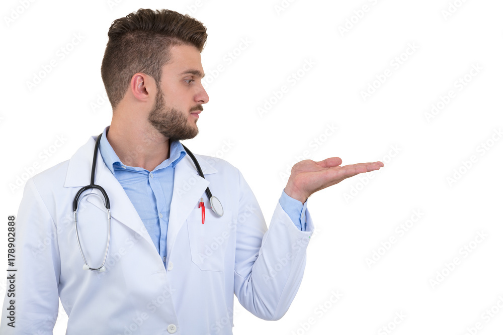 Portrait of a smiling male doctor pointing finger away isolated on a white background Portrait of a smiling male doctor pointing finger away isolated on a white background