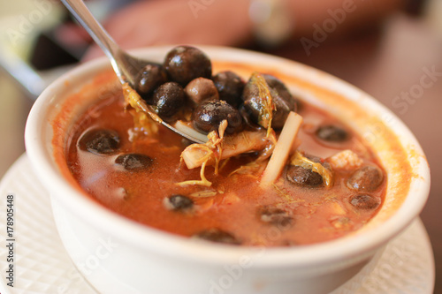 Thailand traditional favorite food spicy soup or "Mushroom Curry". selective focus and with a very shallow depth of field