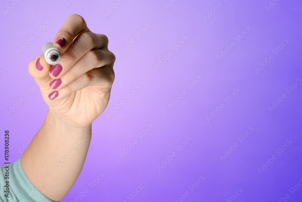 Fototapeta premium Woman's hand with a pencil