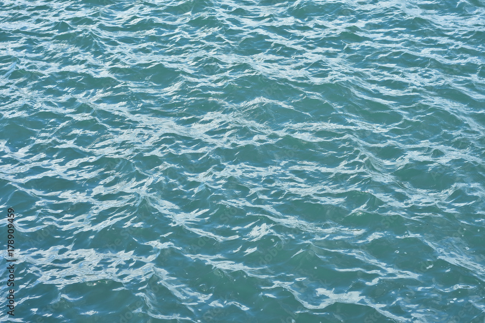 Slightly choppy sea surface with murky green water. Slightly choppy sea surface with murky green water.