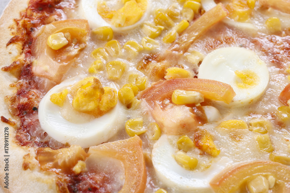 Pizza with eggs, cheese, corn and tomato. Pizza with eggs, cheese, corn and tomato.