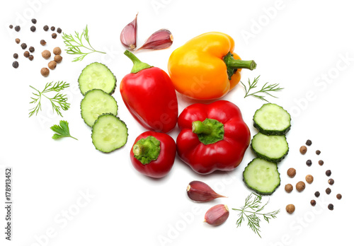 mix of sliced cucumber, garlic, sweet bell pepper and parsley isolated on white background. top view